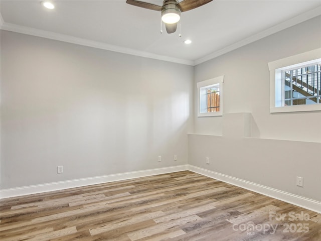 spare room featuring ceiling fan, recessed lighting, wood finished floors, baseboards, and ornamental molding