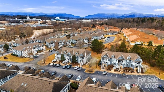 aerial view with a mountain view and a residential view