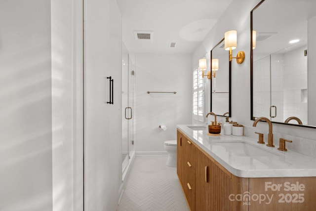 full bath with toilet, a shower stall, visible vents, and a sink