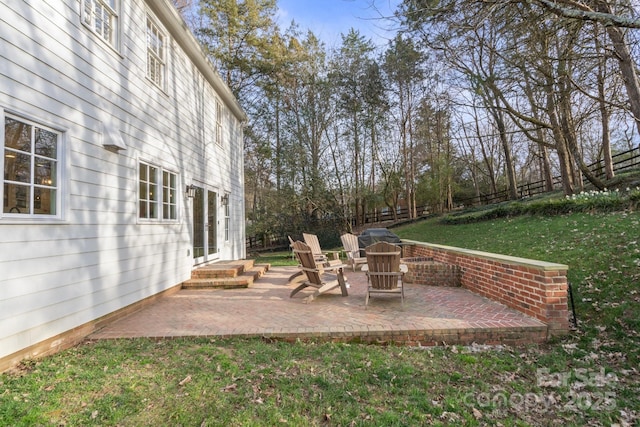 view of yard featuring entry steps, a patio, and fence