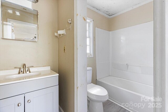 full bath featuring toilet, vanity, shower / bathing tub combination, and wood finished floors