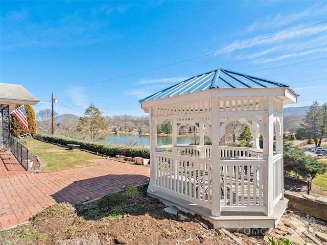 exterior space featuring a water view and a gazebo