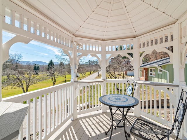 deck featuring a gazebo and a mountain view