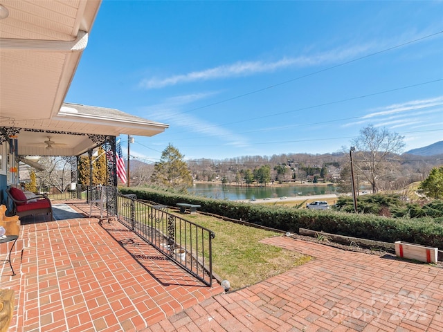 view of patio / terrace with a water view