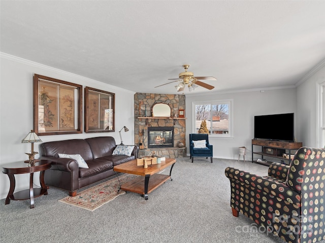 carpeted living area featuring a ceiling fan, a fireplace, and crown molding