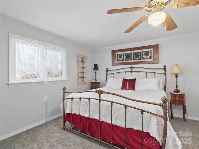 bedroom with carpet, crown molding, baseboards, and ceiling fan