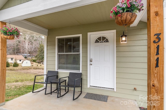 doorway to property with a porch