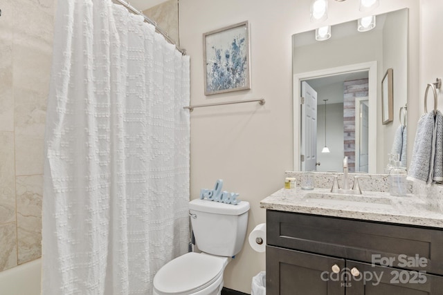 full bathroom with shower / bath combination with curtain, vanity, and toilet