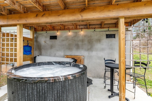 view of patio / terrace with a hot tub