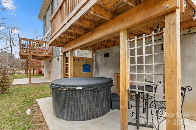 view of patio / terrace with a hot tub