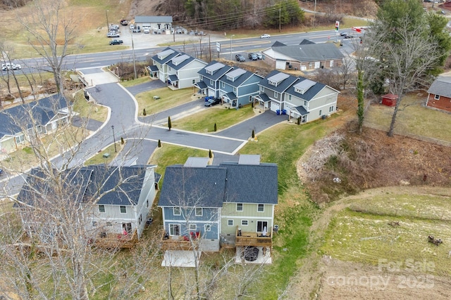 birds eye view of property with a residential view