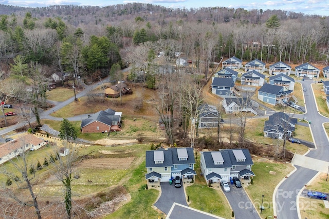 bird's eye view with a residential view and a wooded view