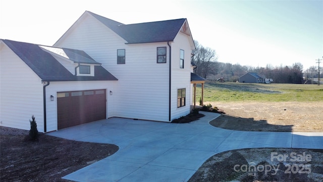 view of home's exterior featuring driveway