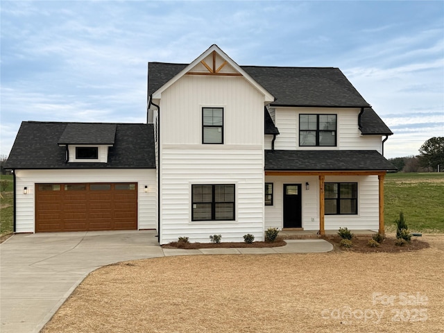 modern farmhouse style home with an attached garage, concrete driveway, and a shingled roof