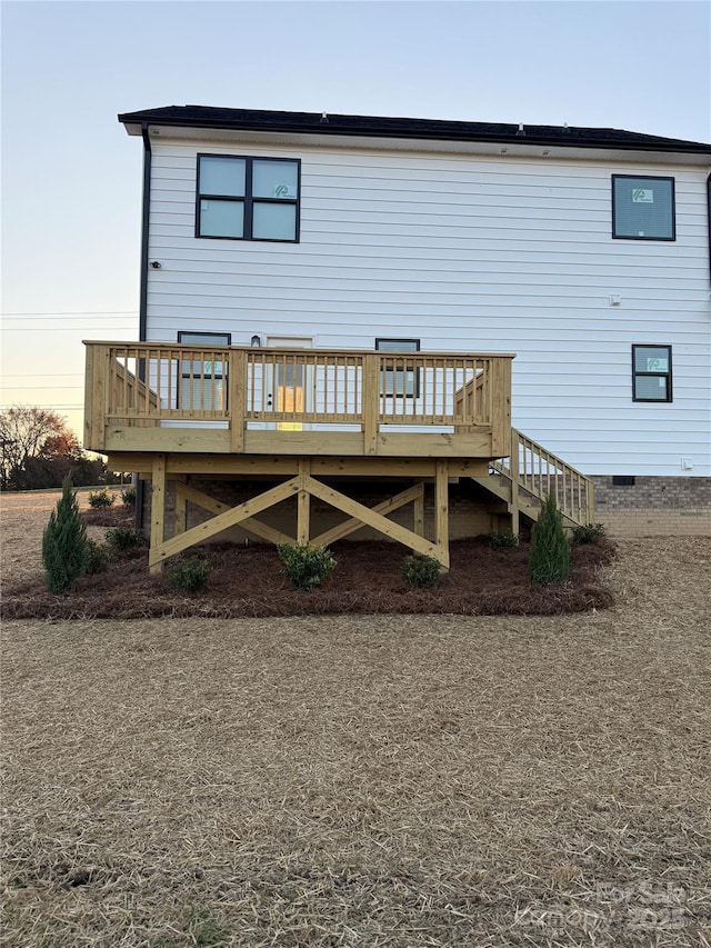 rear view of property with a deck