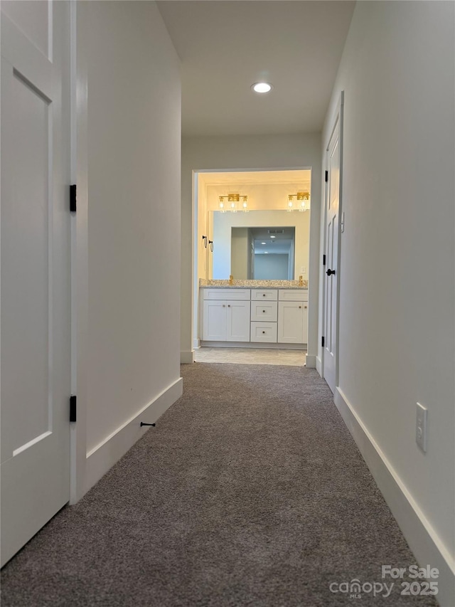 corridor with recessed lighting, baseboards, and carpet floors