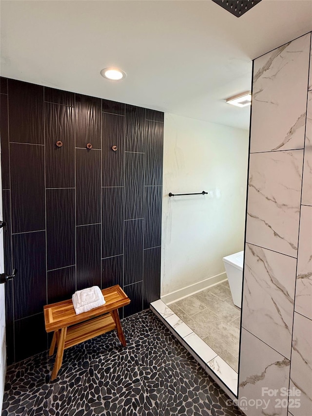 bathroom featuring a tile shower, recessed lighting, tile walls, and a freestanding tub