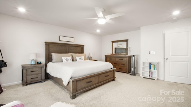 bedroom with a ceiling fan, recessed lighting, light colored carpet, and baseboards