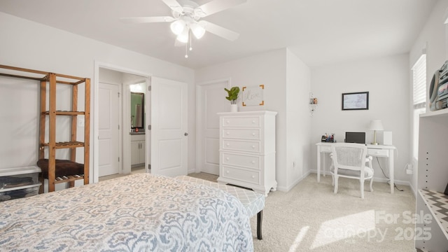 bedroom with light colored carpet and baseboards