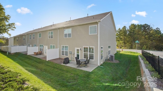 back of property featuring a patio, a yard, fence, and central air condition unit