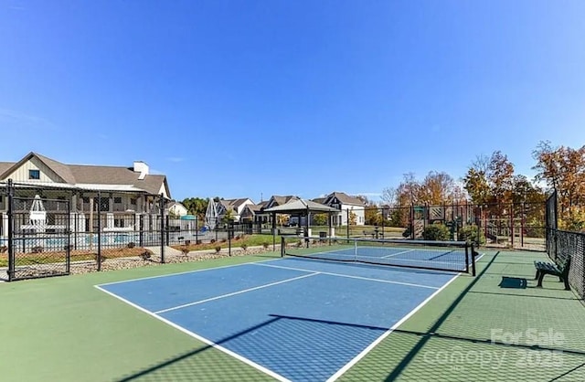 view of sport court with fence