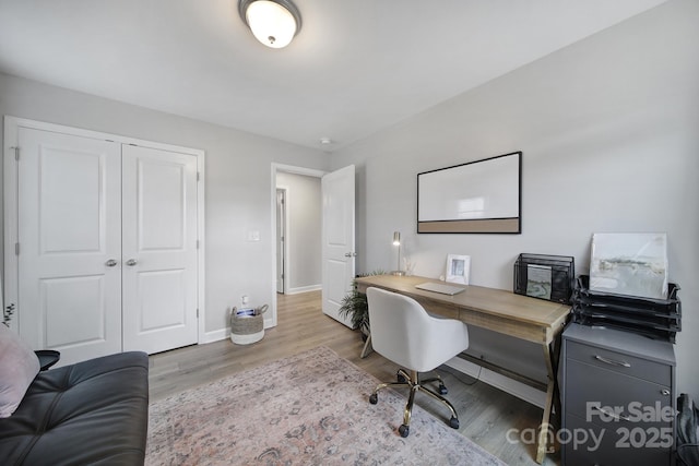 home office with wood finished floors and baseboards