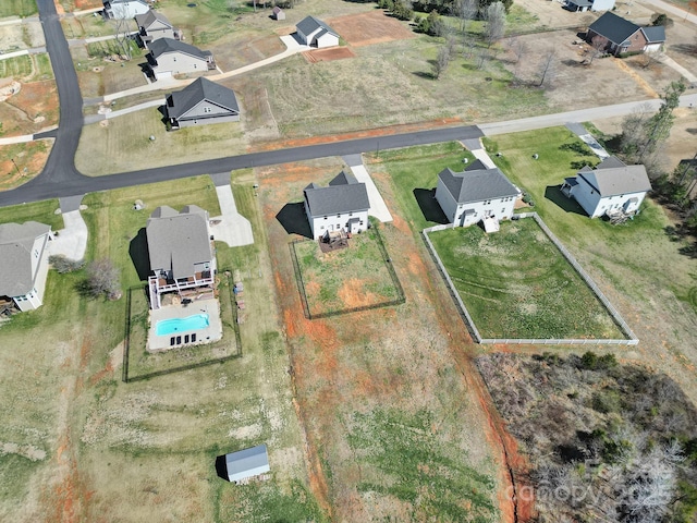 birds eye view of property with a residential view