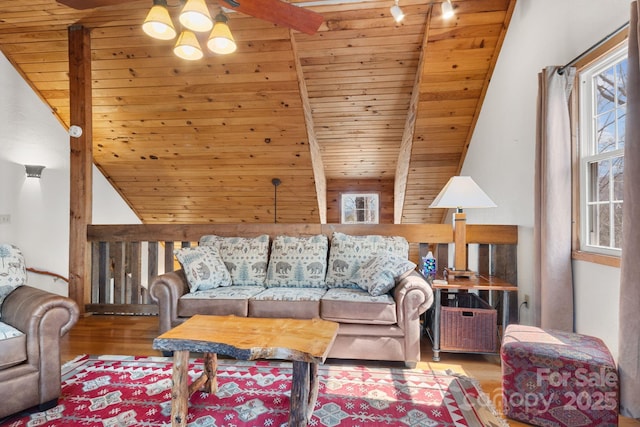 living area featuring wood ceiling, wood finished floors, and vaulted ceiling with beams