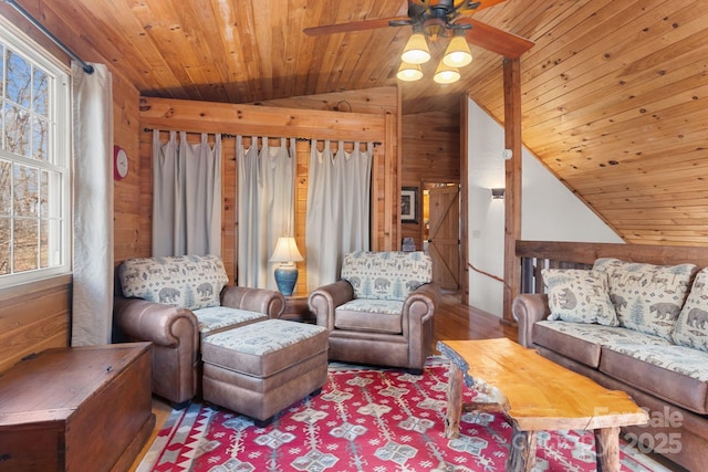 living area with wooden ceiling, vaulted ceiling, and wood walls