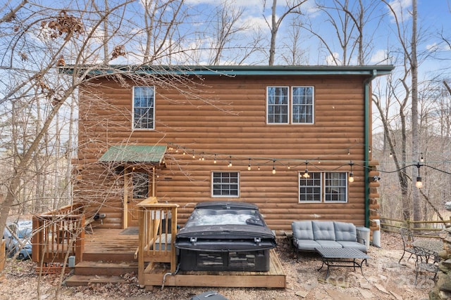 back of house featuring an outdoor hangout area