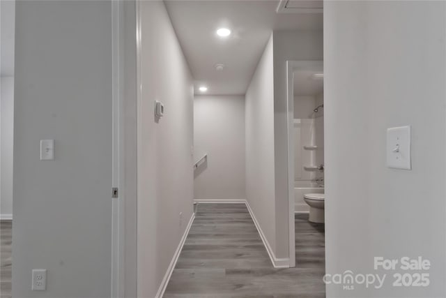 hall with recessed lighting, baseboards, and wood finished floors