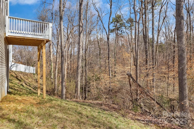 view of yard with a view of trees