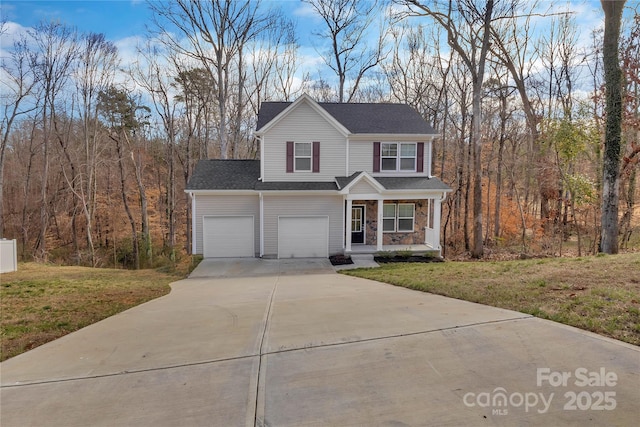 traditional-style house with a porch, stone siding, driveway, and a front lawn