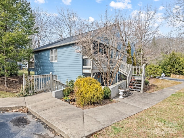 view of property exterior featuring stairway