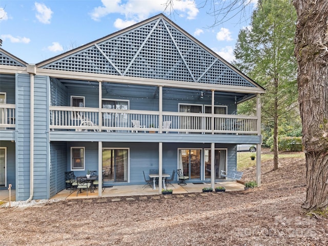 back of property with a patio