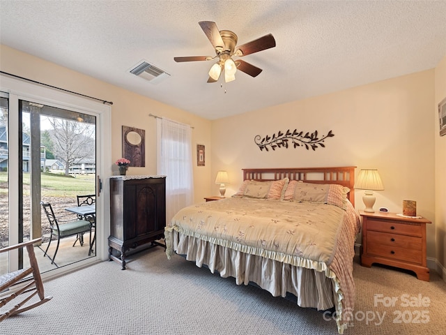 bedroom with visible vents, ceiling fan, access to exterior, a textured ceiling, and carpet floors