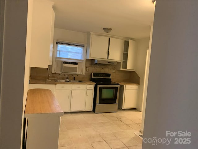 kitchen featuring tasteful backsplash, white cabinetry, a sink, under cabinet range hood, and stainless steel electric range