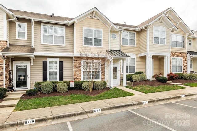 multi unit property with stone siding