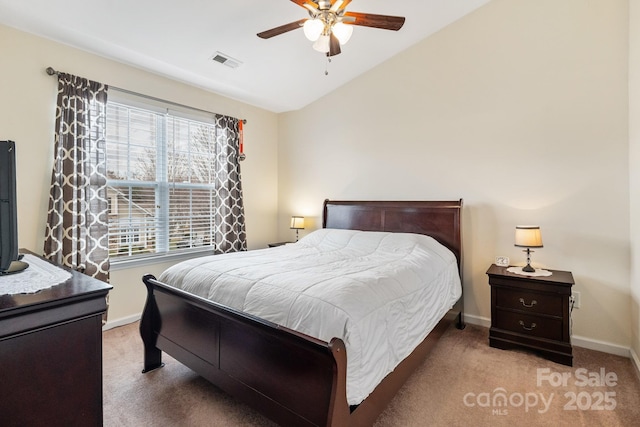 bedroom with lofted ceiling, carpet, visible vents, and baseboards