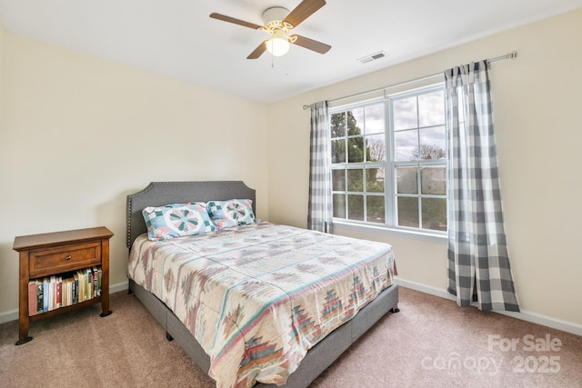 bedroom with carpet, visible vents, and baseboards