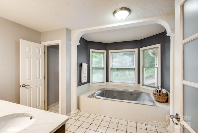 4825 1st Street Ct NW, Hickory, NC 28601 - bathroom with ornate columns, vanity, a whirlpool tub, tile patterned flooring, and plenty of natural light