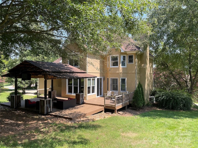 4825 1st Street Ct NW, Hickory, NC 28601 - back of property with a yard, an outdoor hangout area, a wooden deck, and stucco siding