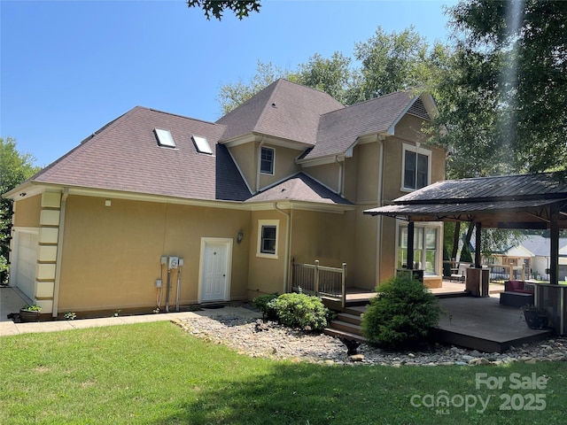 4825 1st Street Ct NW, Hickory, NC 28601 - back of property featuring stucco siding, a gazebo, a wooden deck, a lawn, and roof with shingles