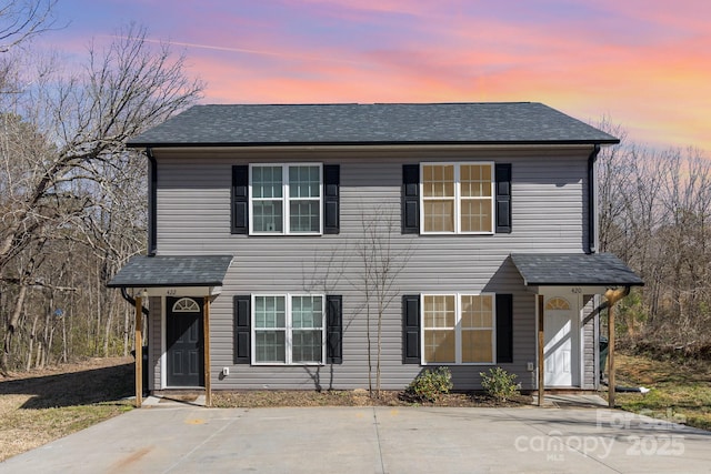 view of front of property with roof with shingles