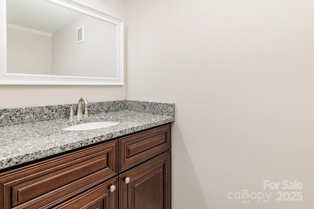 bathroom with vanity and visible vents