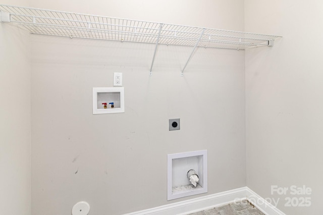 clothes washing area featuring laundry area, baseboards, hookup for a gas dryer, hookup for a washing machine, and electric dryer hookup