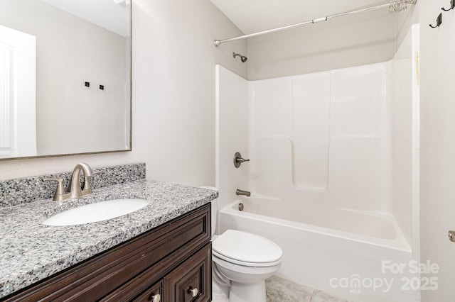 bathroom featuring tub / shower combination, vanity, and toilet