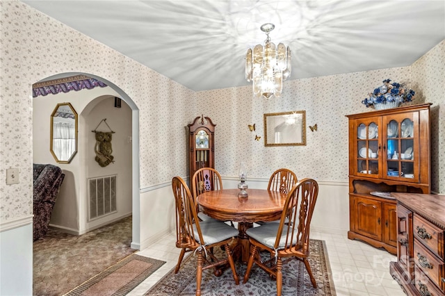 dining room with visible vents and wallpapered walls