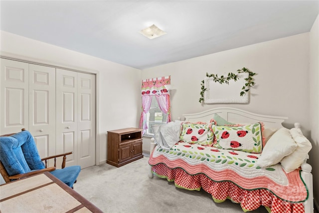 carpeted bedroom featuring a closet