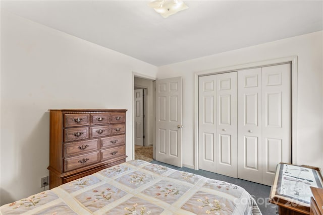 bedroom with carpet and a closet